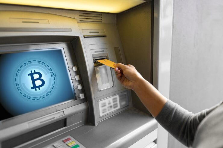 Customer using a cash machine at a Baltimore retail counter
